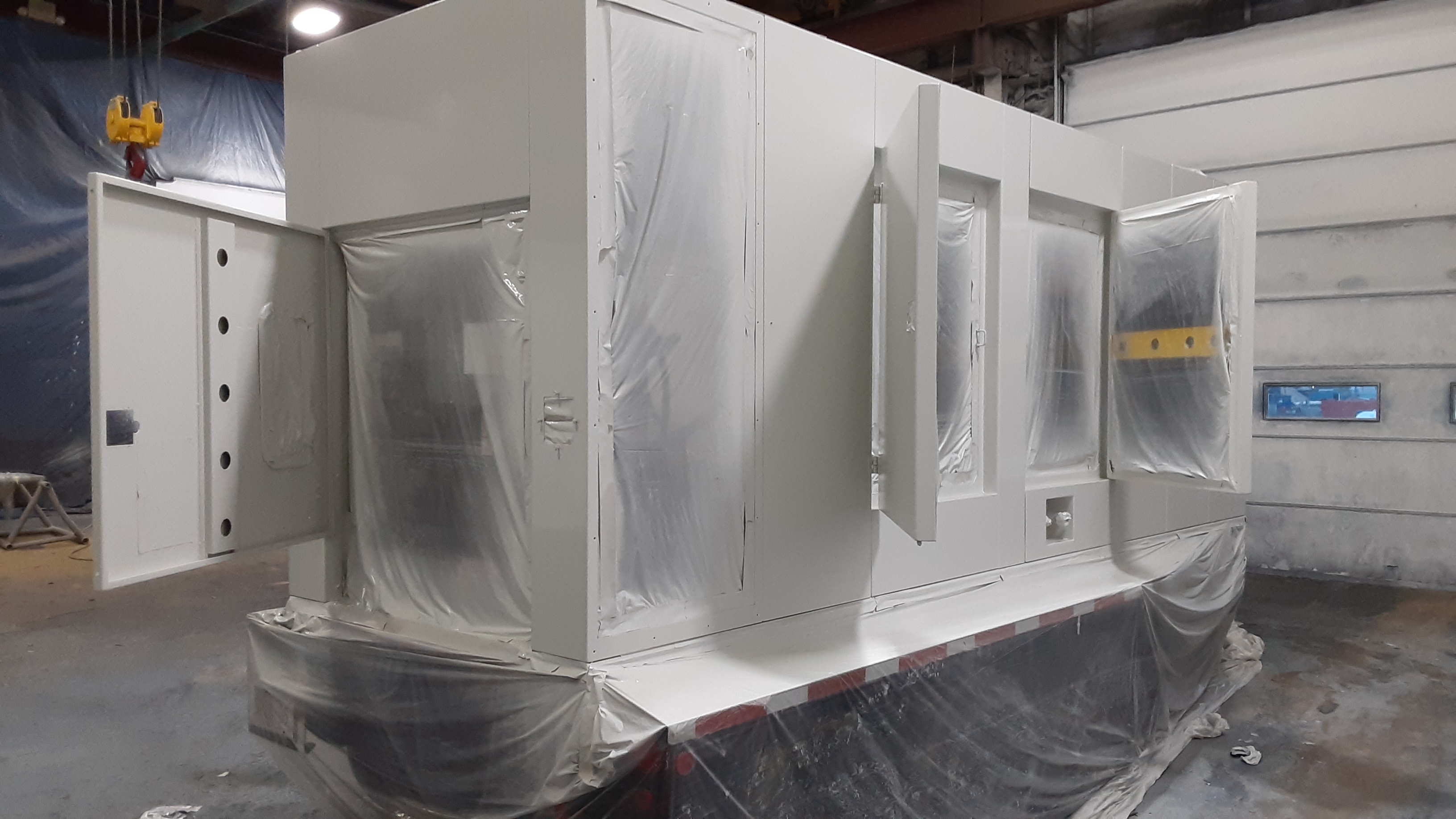 A generator respray being unmasked for final touch ups